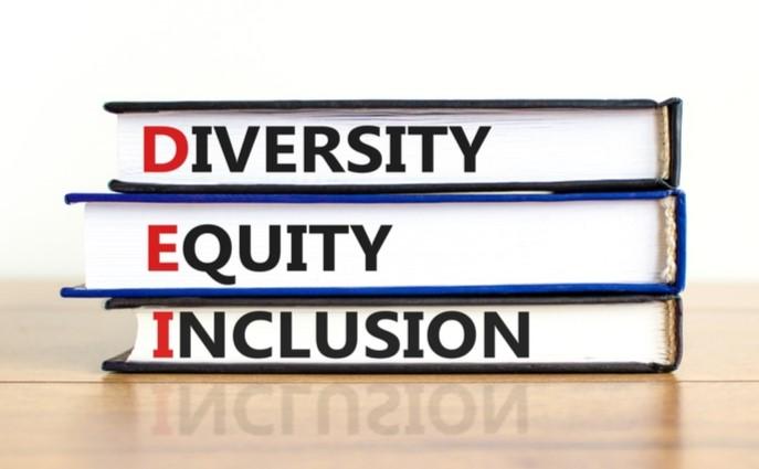 Diversity, Equity, Inclusion written on the spine of three stacked books