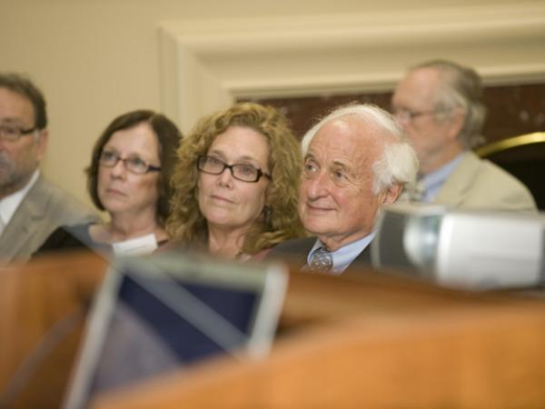 Congressman Levin and other audience members listen to event presentations