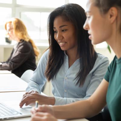 Two women at a laptop