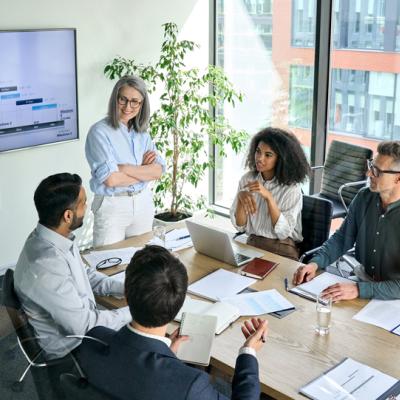 People in conference room around table