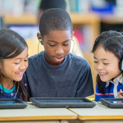 Children playing on an iPad