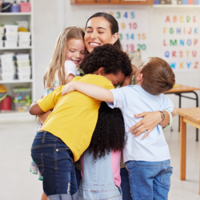 Teacher Hugging Students