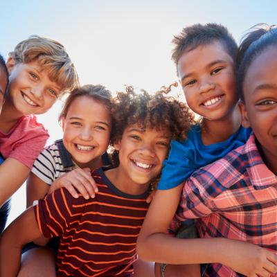 Diverse kids huddled together