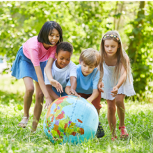 children rolling globe