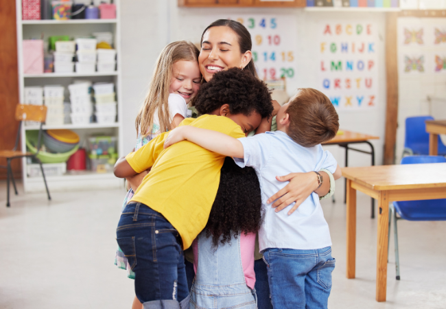 Teacher Hugging Students