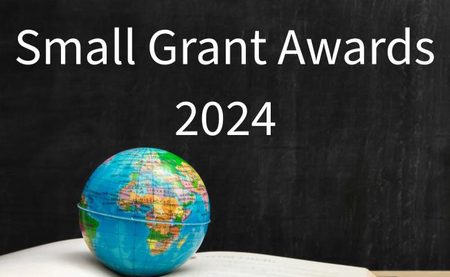 Small Grant Awards chalkboard with book and globe 2024